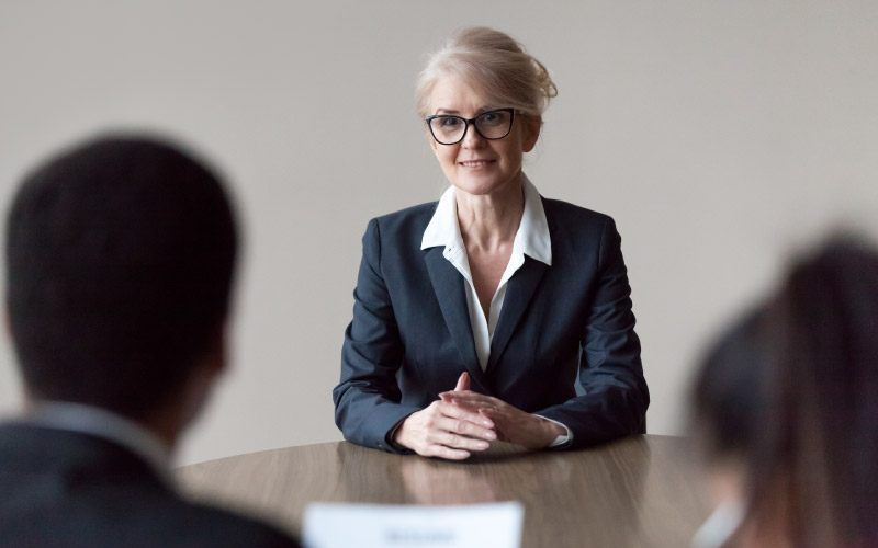 Smiling middle-aged female job applicant making first impression