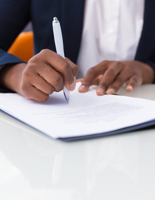 Close-up of African American businesswoman signing contract
