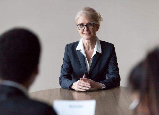 Smiling middle-aged female job applicant making first impression