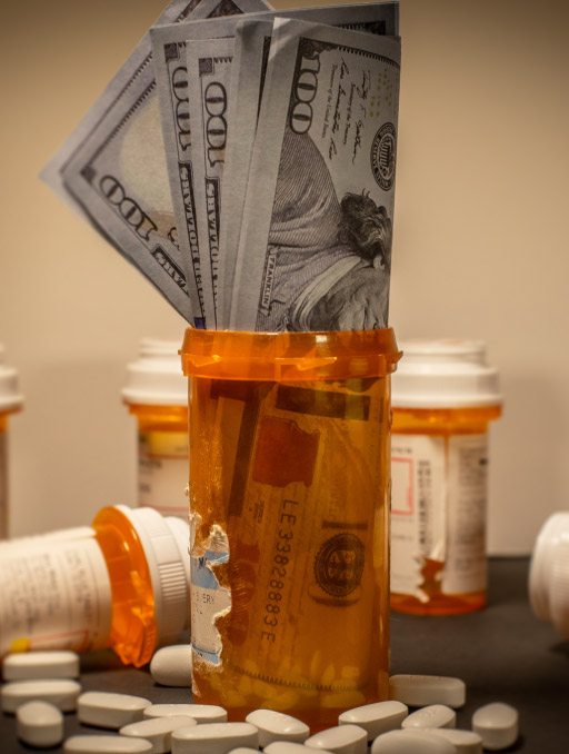 American currency in a prescription drug bottle