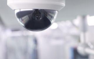 close-up of security camera mounted on ceiling