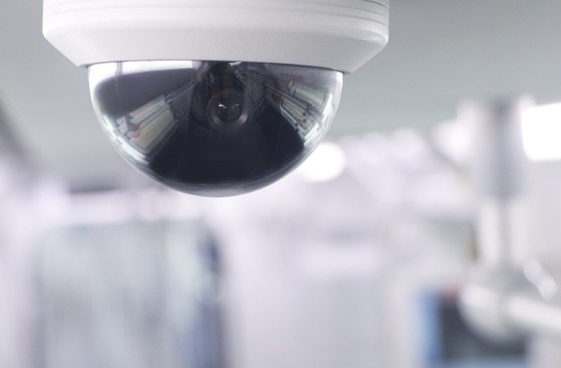 close-up of security camera mounted on ceiling