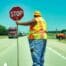 Flagger holding sign